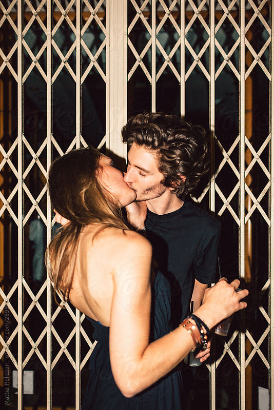 Young Couple Kiss on the Street by Mattia Pelizzari