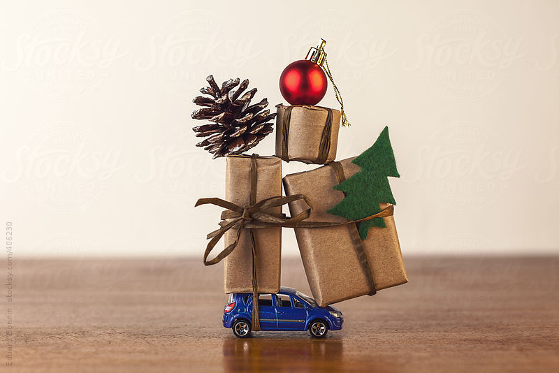 Three Christmas gift boxes on blue toy car. by Eduard Bonnin