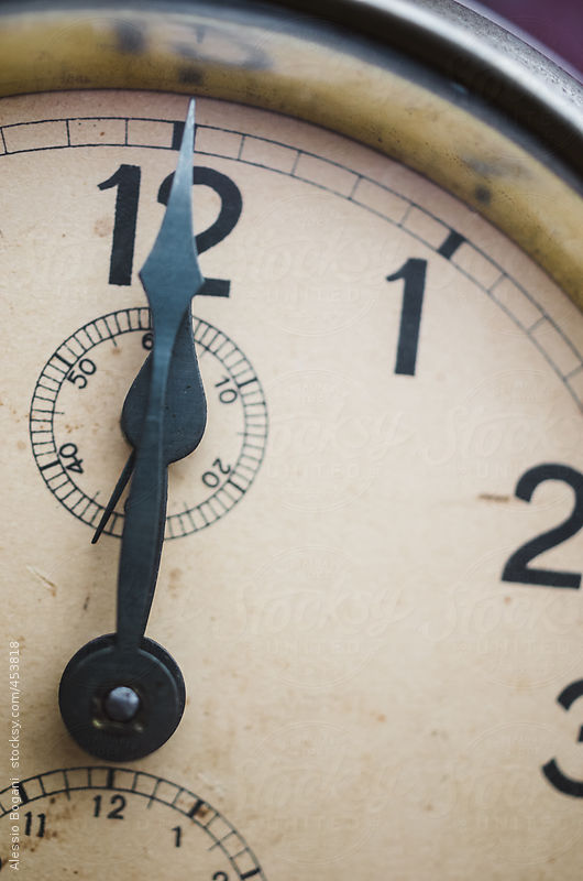 Close up of vintage clock at midday or midnight by Alessio Bogani
