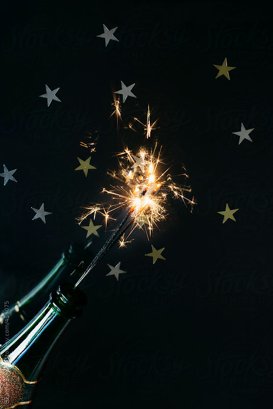 Bottle of champagne with sparkler for celebrating New Year by Beatrix Boros