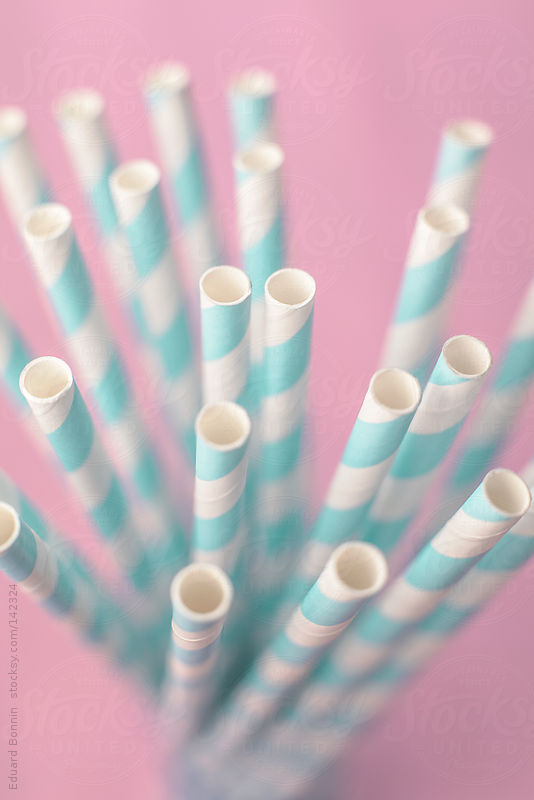 Close up of straws over pink background. Pastel tones. by Eduard Bonnin