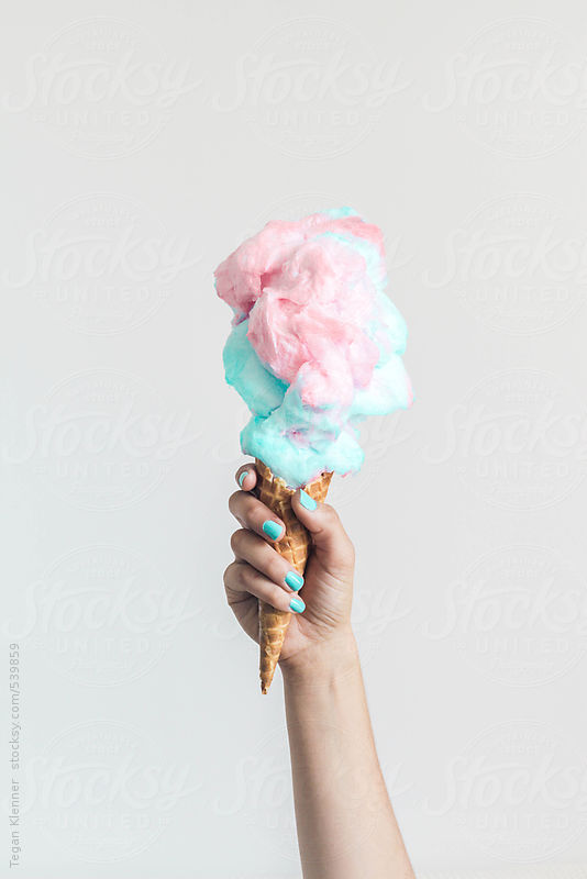 Hand holding a Cotton Candy Ice Cream Cone by Treasures & Travels