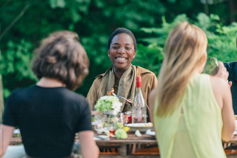 Adorable Woman Laughing At Dinner Party