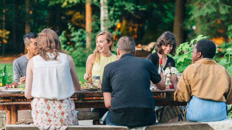 Friends Eating Dinner Outdoors