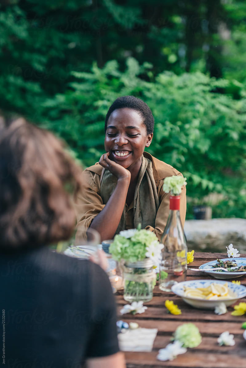 Woman Laughing At Dinner Party