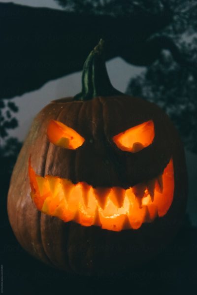 Halloween stock photo of a creepy lit jack o'lantern