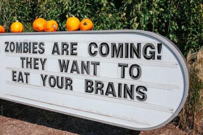 Stock photo of a sign warning of the impending zombie apocalypse.